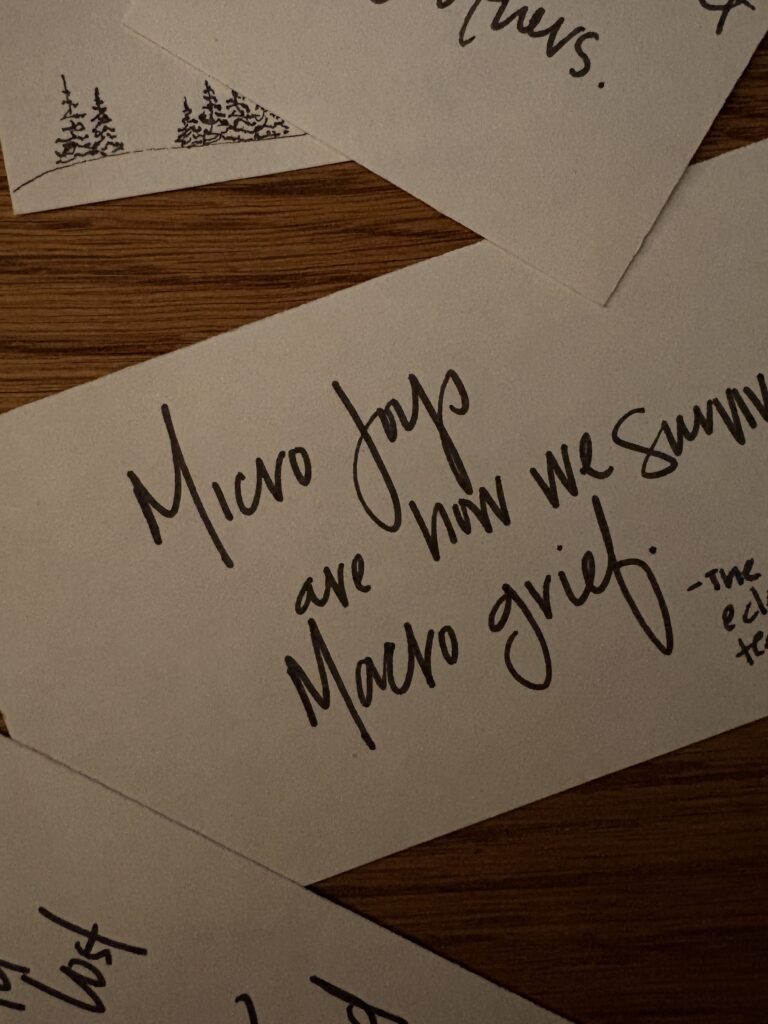 In image of the quote" micro joys are how we survive the macro grief" by The Eclectic Tea