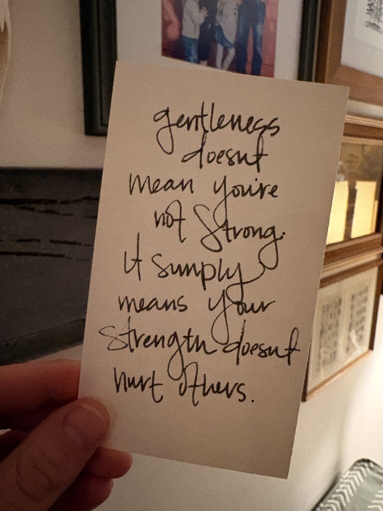An image of a note card with the quote, "Gentleness doesn't mean you're not strong. It simply means your strength doesn't hurt others."
